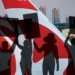 montage illustration of picketers with Air Canada Rouge aircraft